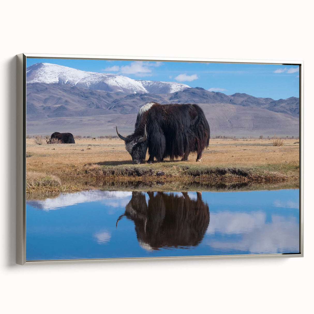 Framed canvas of a vintage-style landscape painting depicting a colorful Tibetan scene.