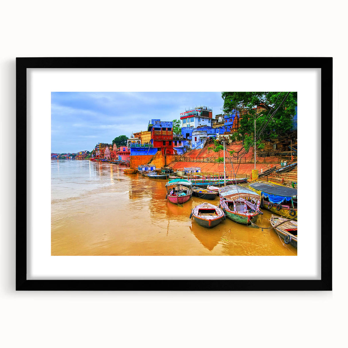Abstract art print of vibrant, colorful Indian scenery on textured canvas, framed in black, ideal for living room decor.