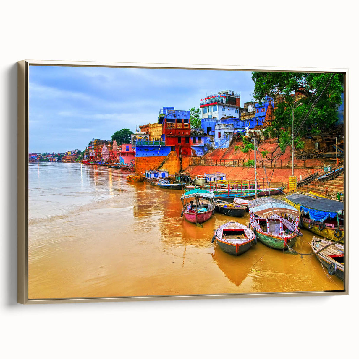 Framed canvas featuring a vintage-style landscape painting of an Indian scenery in gold and black tones.