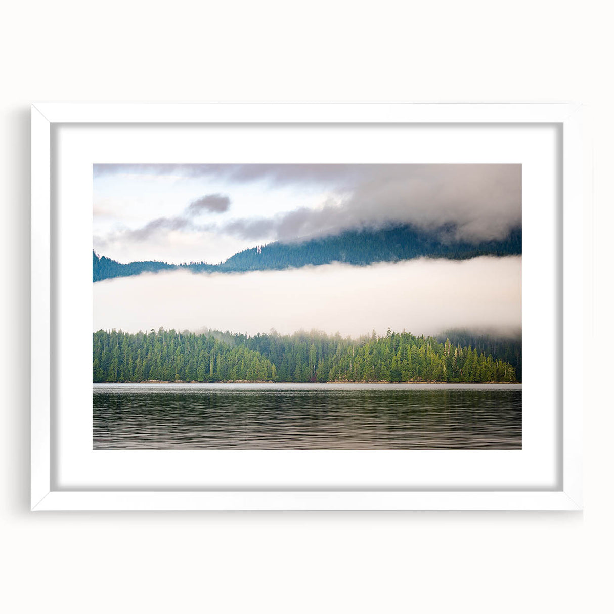 Abstract art print of British Columbia scenery in muted green and blue tones, framed with a white mat.