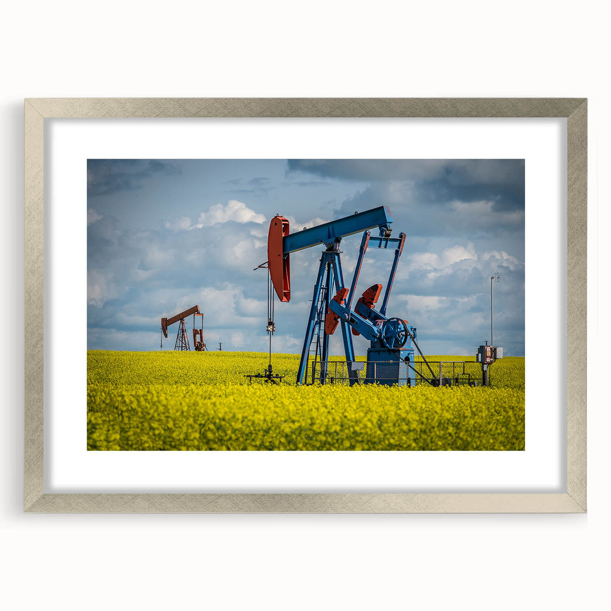 Textured abstract art print of Saskatchewan scenery in muted earth tones, framed in silver, suitable for bedroom decor.