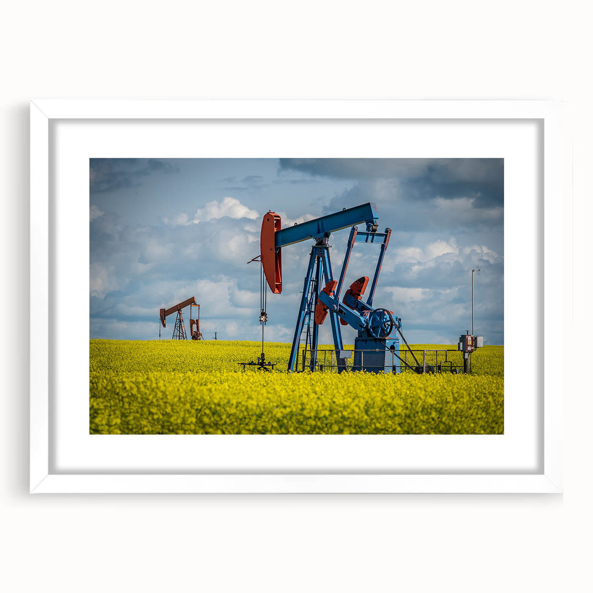 Abstract art print of Saskatchewan scenery in muted earth tones on a white-matted frame.