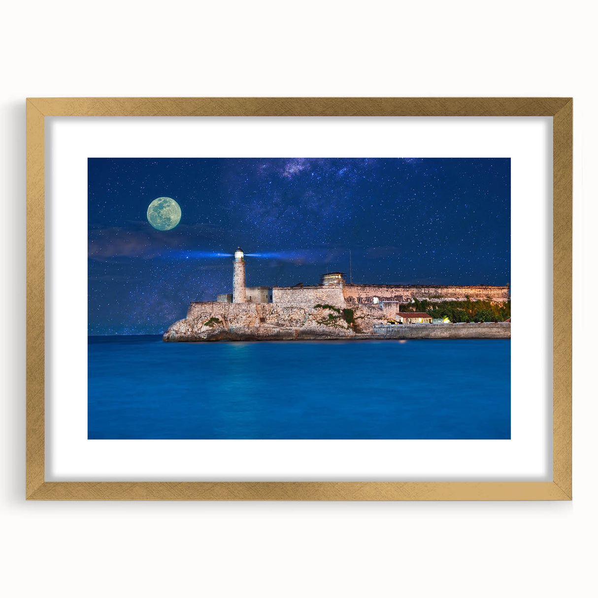 Abstract art print of Caribbean scenery in a gold frame with mat, featuring soft blue and green hues.