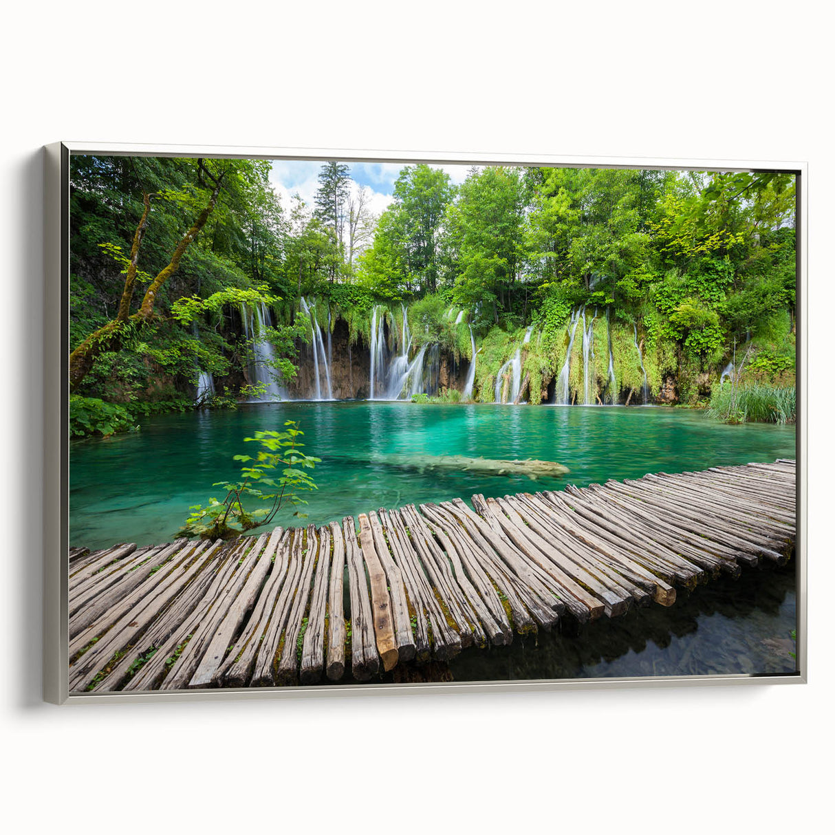 Framed canvas featuring a vintage-style landscape painting of a Croatian coastal scene with colorful buildings and a black…