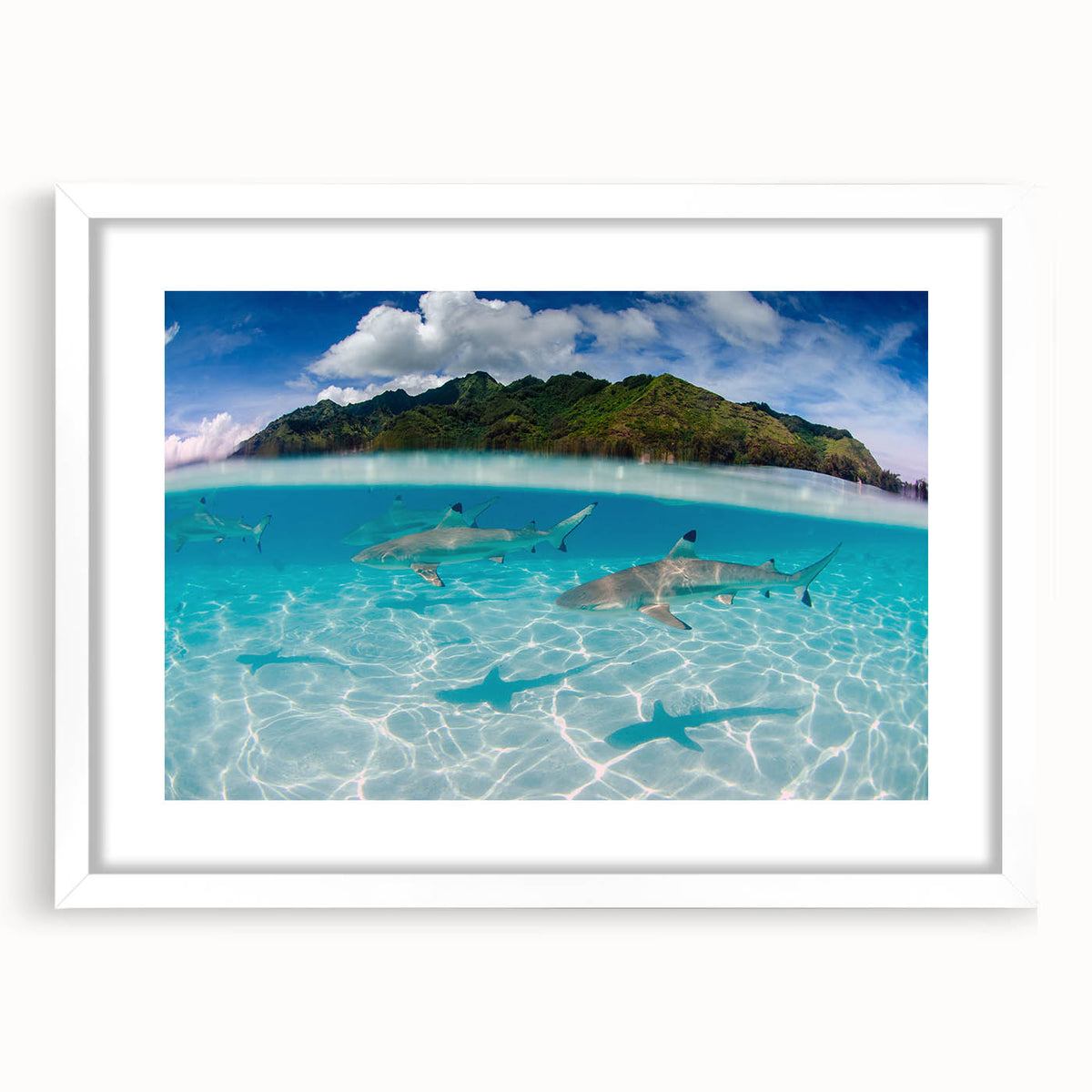 Abstract art print of French Polynesia's oceanic scenery in muted blue and green tones, framed with a white mat.