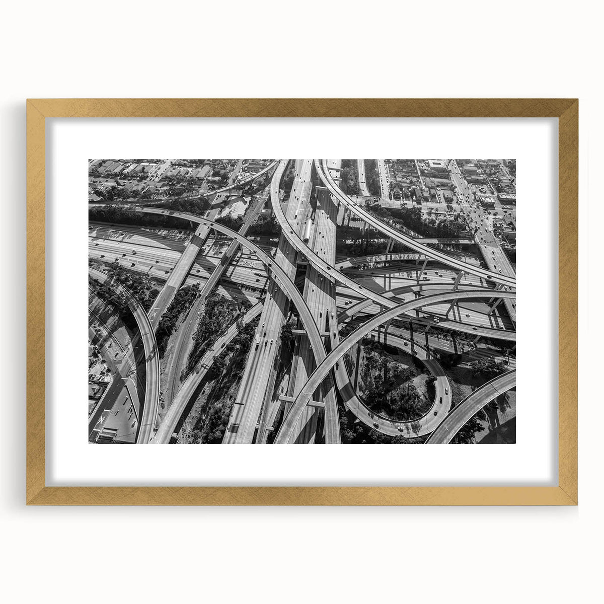 Extra large abstract art print of Los Angeles skyline with textured details in muted gold and blue tones, framed in gold.