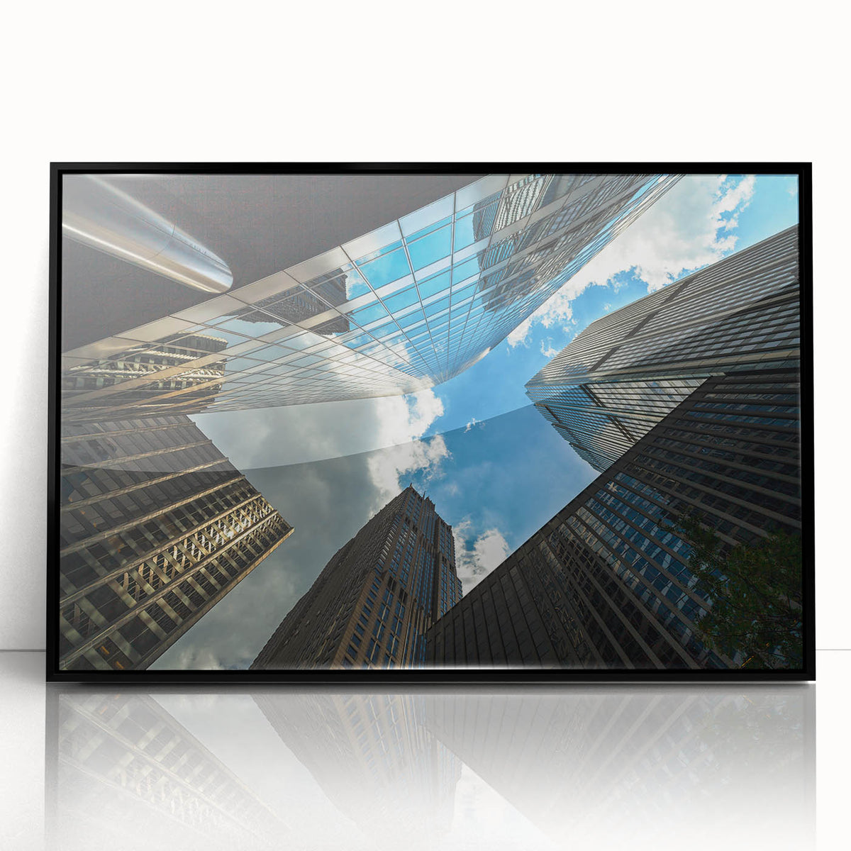 Framed acrylic print of a large abstract wall art depicting Chicago's skyline in muted black and gray tones.