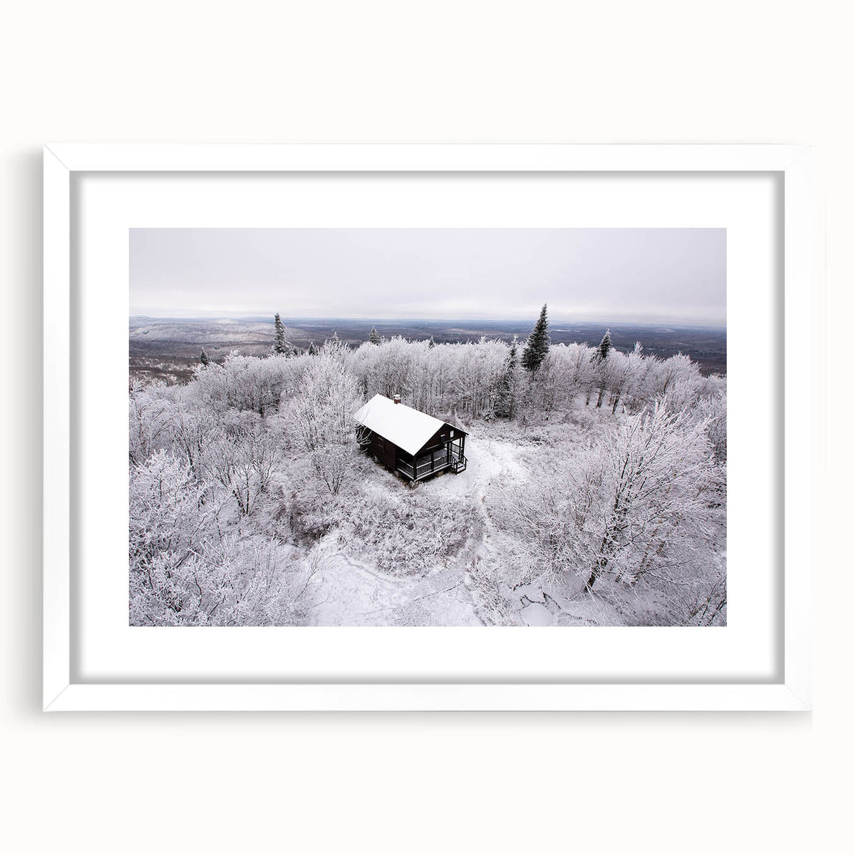 Abstract art print of Adirondack scenery in muted earth tones, framed in white, ideal for dining room decor.