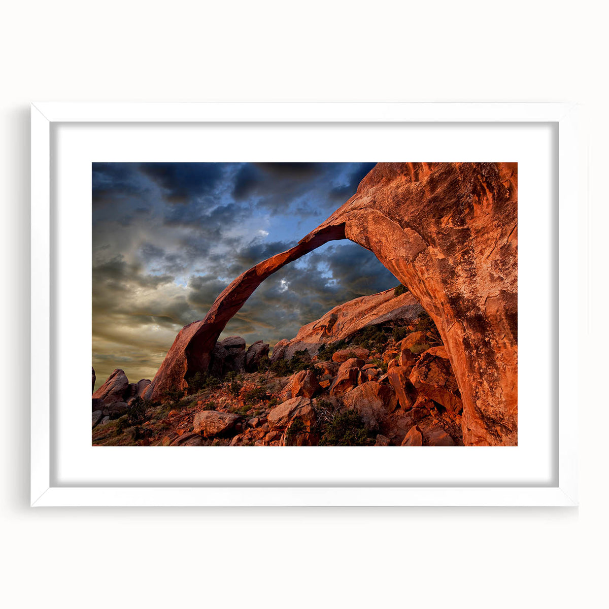 Abstract art print of Arches National Park in muted earth tones on a framed white mat, ideal for dining room decor.
