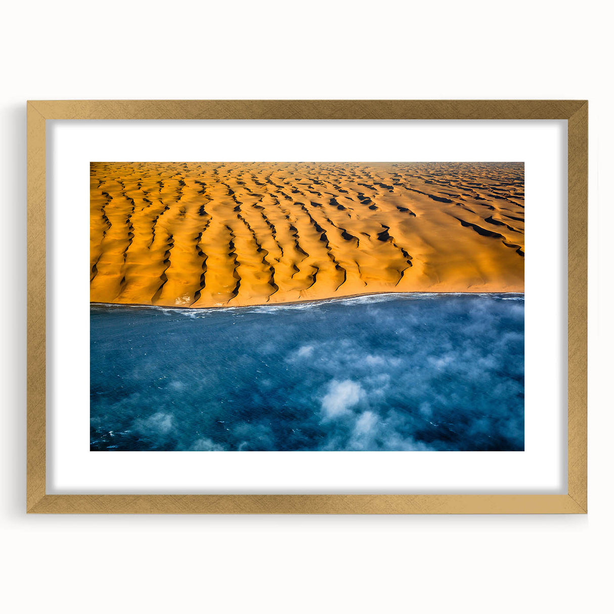 Textured abstract art print of a serene Namibian landscape in muted earth tones, framed in gold, ideal for bedroom art.
