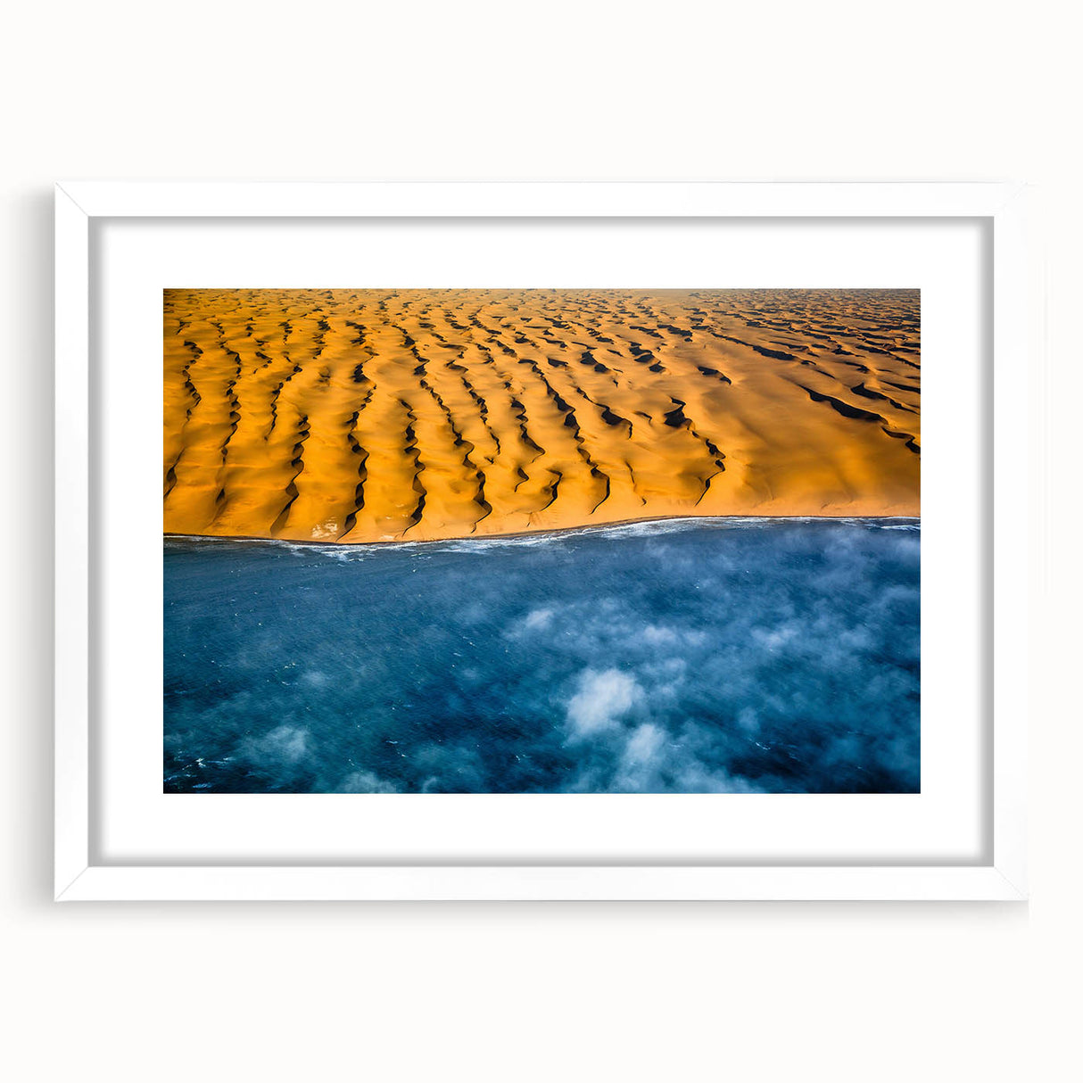 Extra large abstract art print of a textured Namibian landscape in muted earth tones, framed with a white mat.