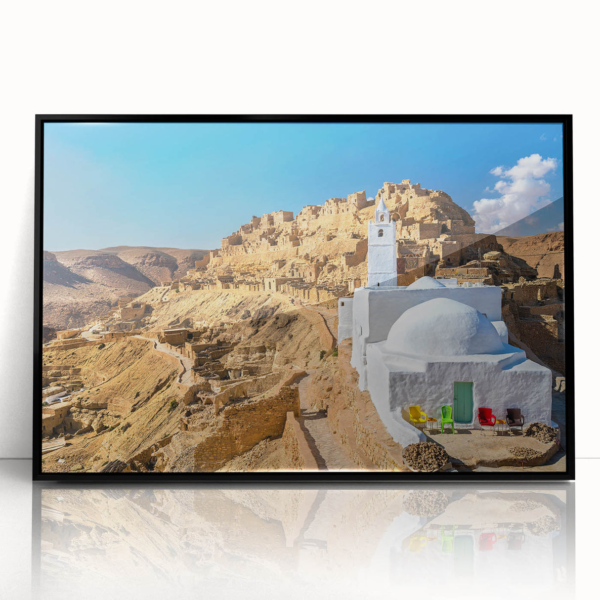 Large abstract wall art depicting a Tunisian landscape in muted earth tones, framed in black acrylic.