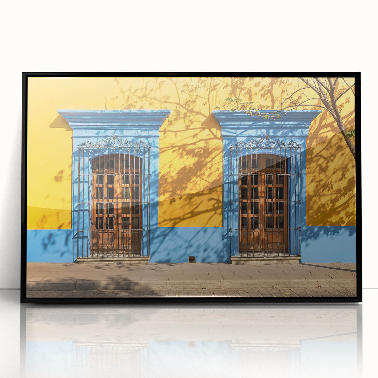 Large abstract wall art depicting a vibrant Oaxaca, Mexico scenery in mid-century modernist style, framed in black acrylic.