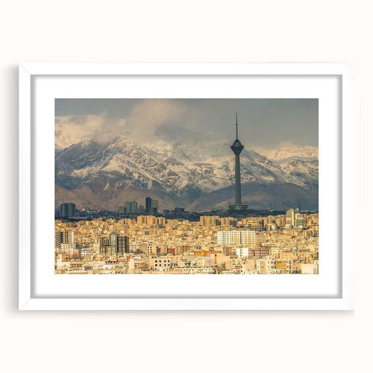 Abstract art print depicting a Middle Eastern scenery in muted earth tones on a white framed canvas.