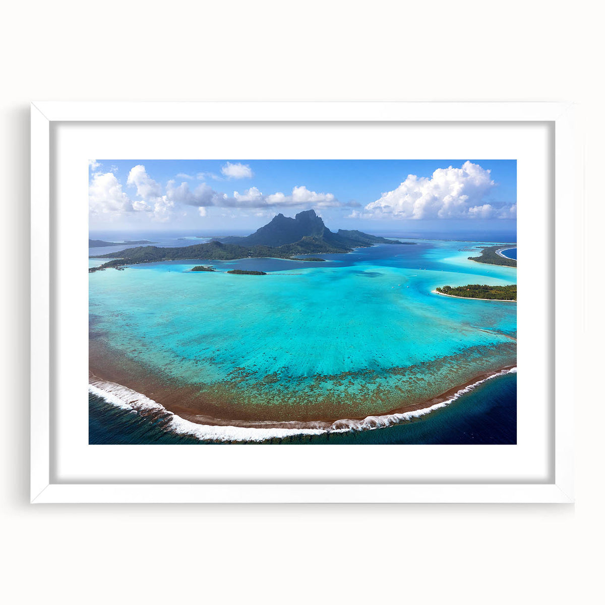 Abstract art print of Bora Bora landscape in soft blue and green tones on a white framed canvas.