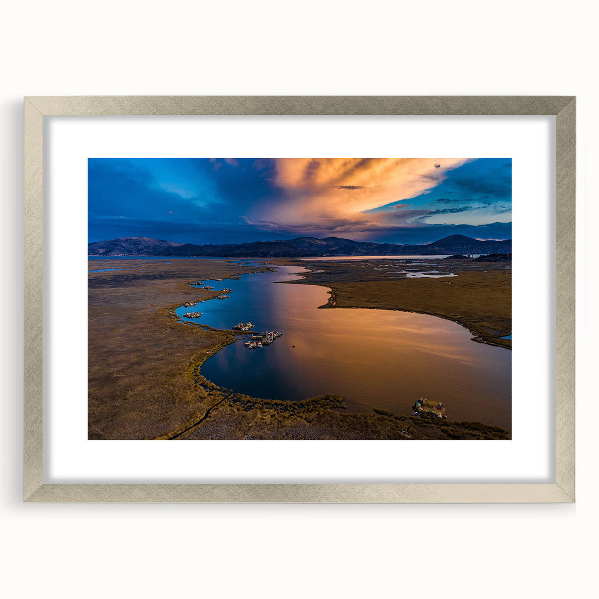 Textured abstract art print depicting a stylized South American landscape in earth tones, framed in silver.