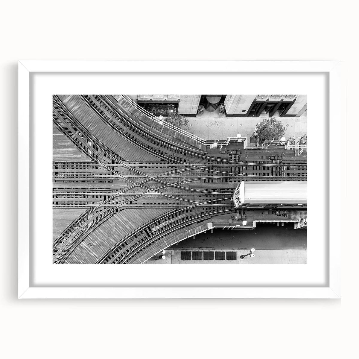 Abstract art print of the Chicago skyline, featuring muted gray and blue tones on a framed white mat.