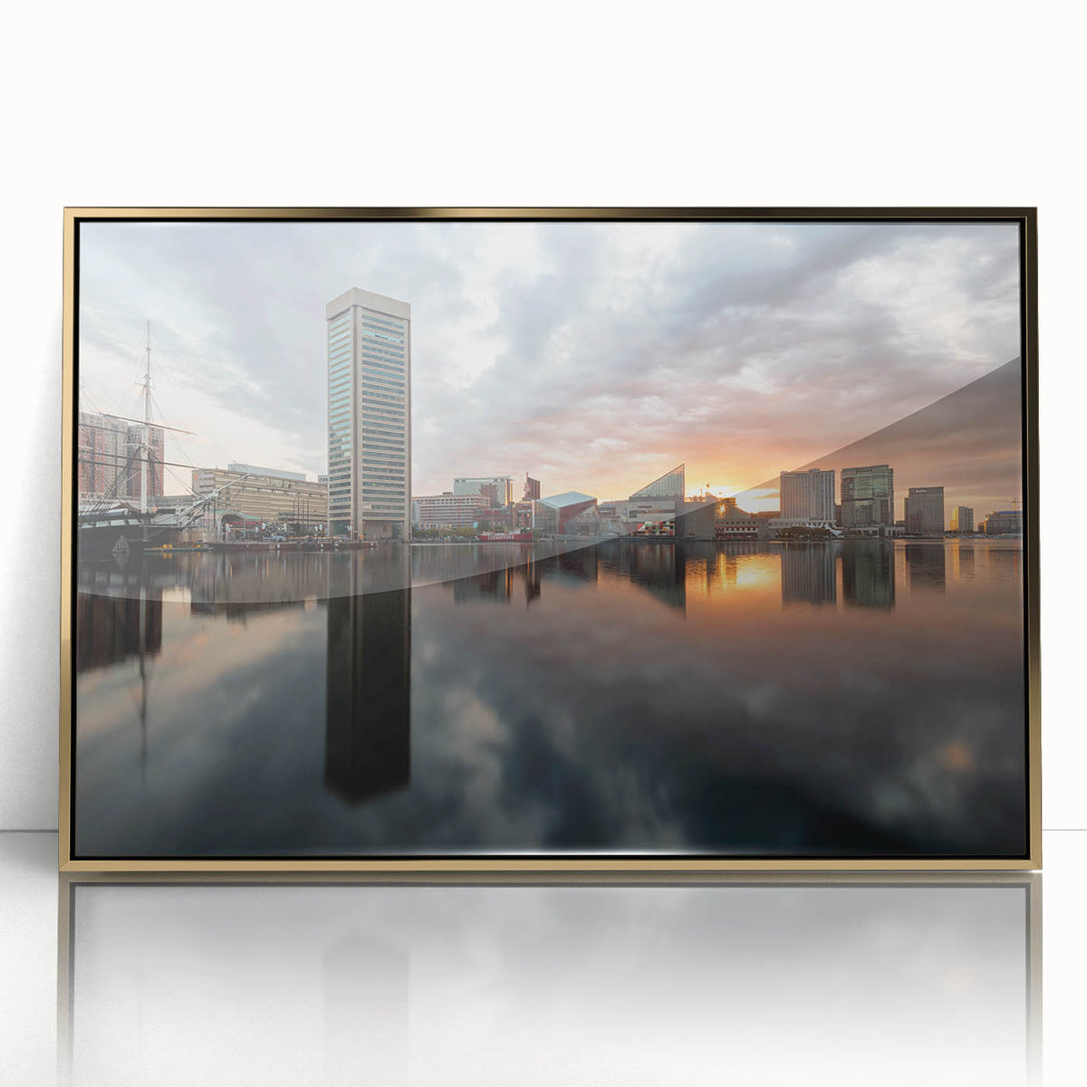 Framed acrylic print of Baltimore skyline in muted gold and blue tones, suitable as modern art wall decor.
