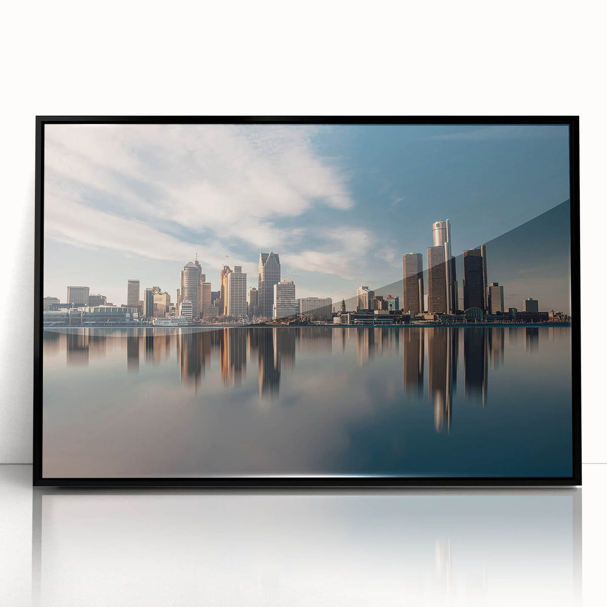 Large abstract wall art of Detroit skyline in muted gray, acrylic print in black frame, ideal for modern living room decor.