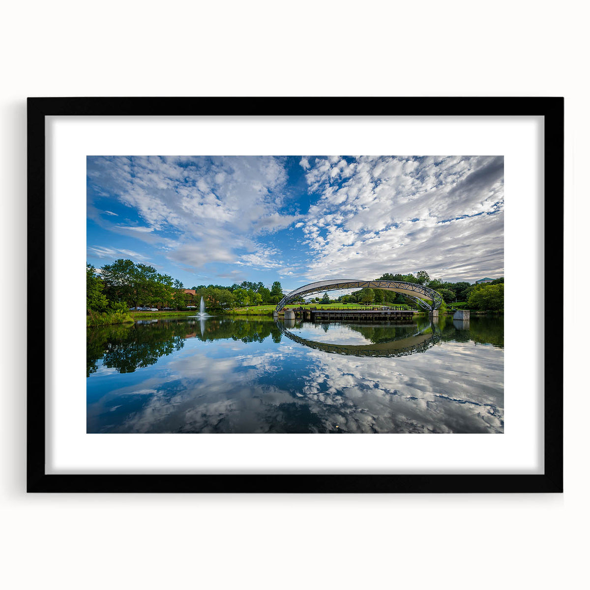 Abstract art print of Charlotte skyline featuring vibrant, colorful textures on a large framed canvas.
