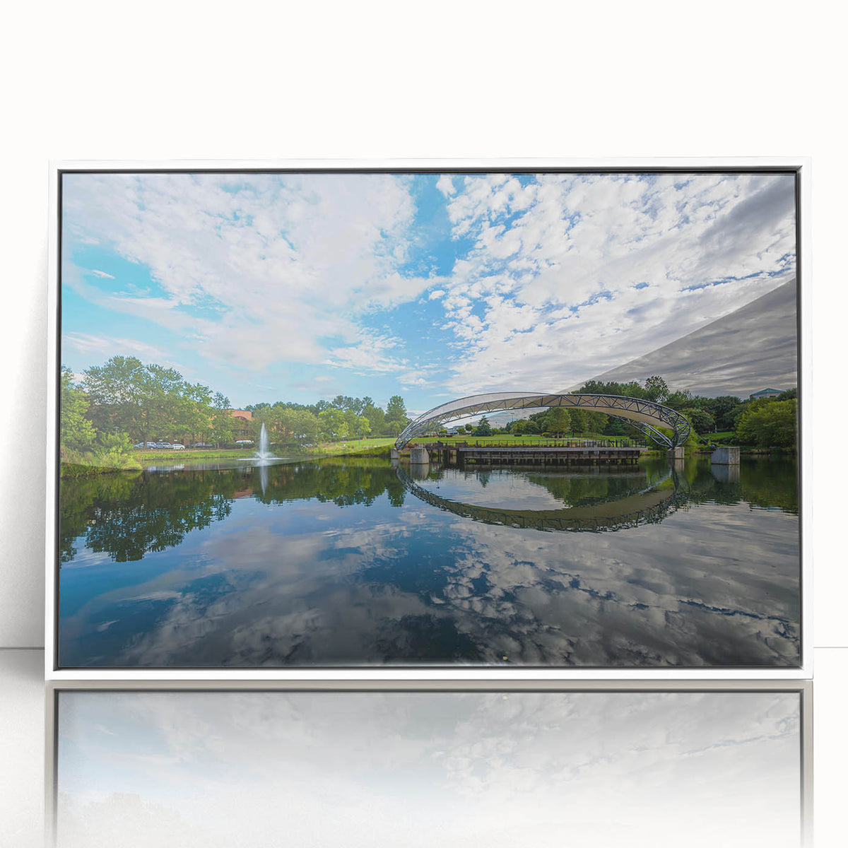 Acrylic print of Charlotte skyline in muted blue shades, framed in white, suitable as modern art wall decor for a nursery.