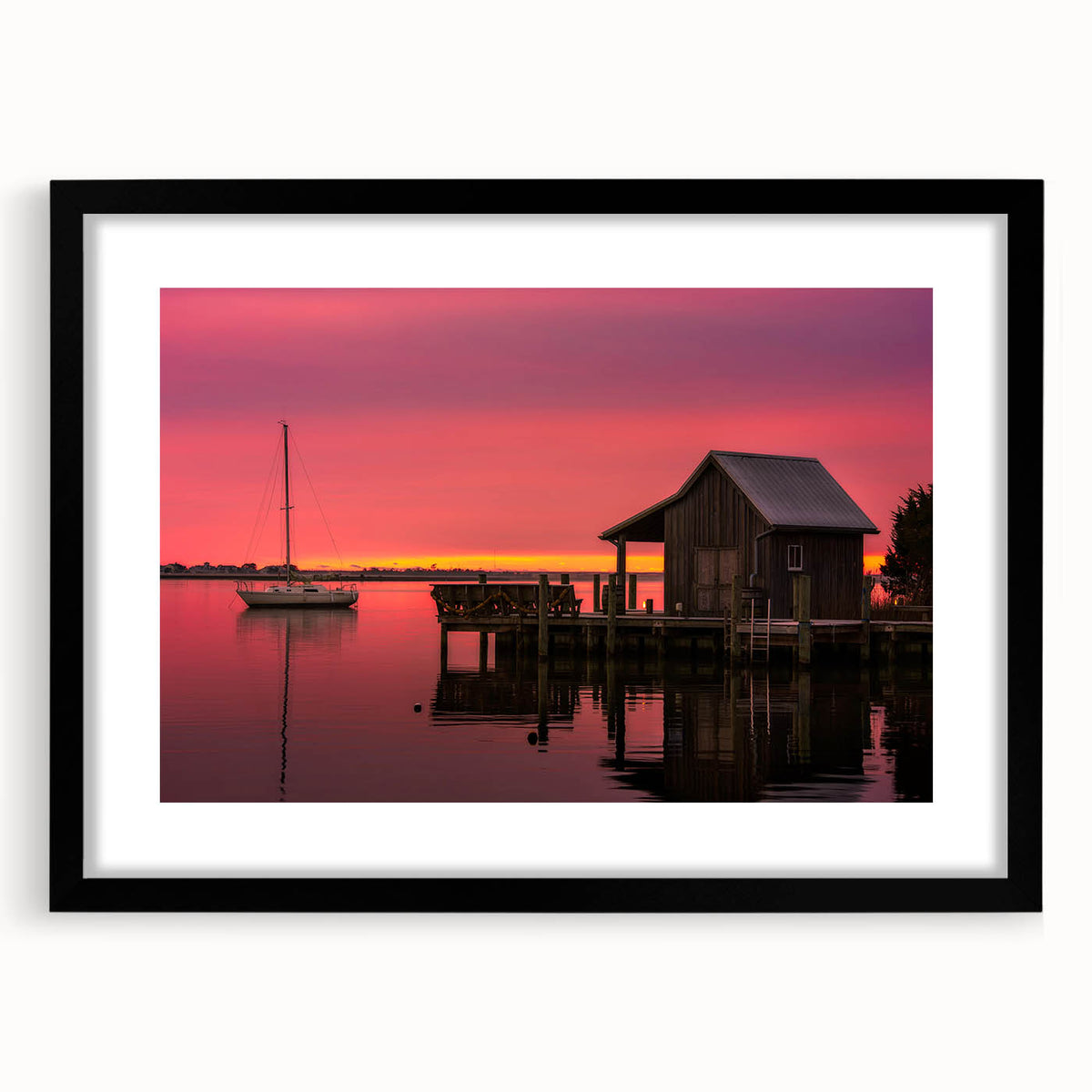 Colorful abstract art print of Outer Banks scenery in vibrant hues on a large framed canvas, ideal for living room decor.