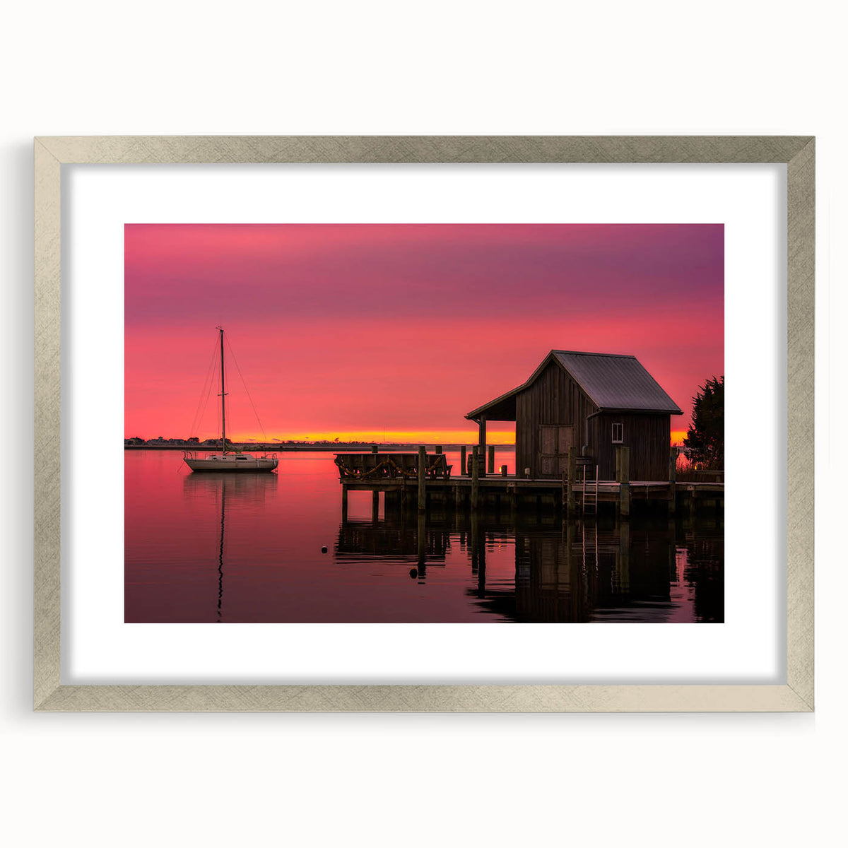 Textured abstract art print of Outer Banks scenery in muted earth tones, framed in silver, ideal for bedroom art.