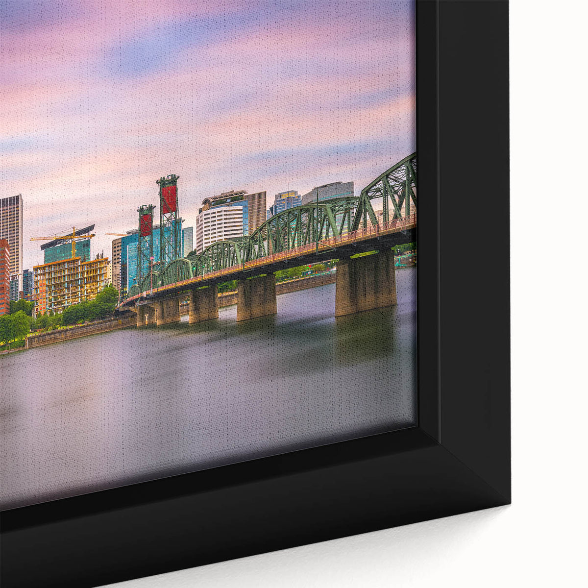 Close-up of textured black wall art depicting Portland, Oregon, with vibrant color splashes on framed canvas.