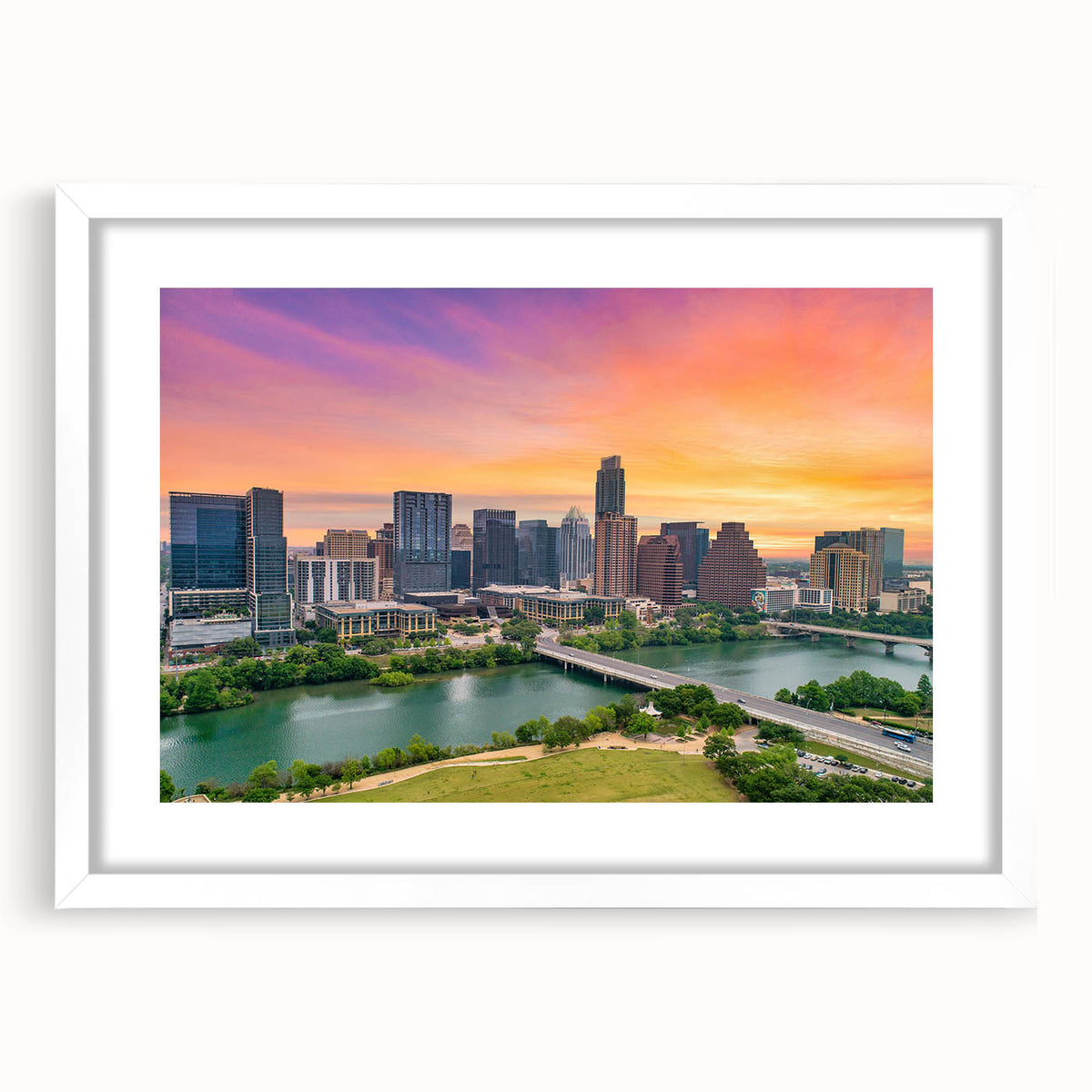 Abstract art print of Austin skyline in muted blue and gray tones on a white framed canvas.
