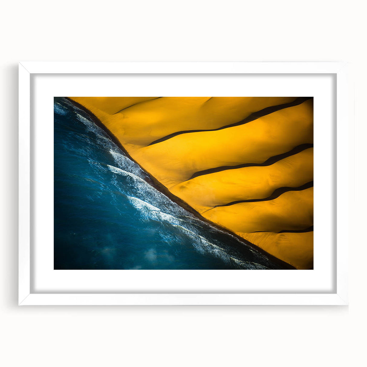 Extra large abstract art print depicting a textured African scenery in earthy tones, framed with a white mat.