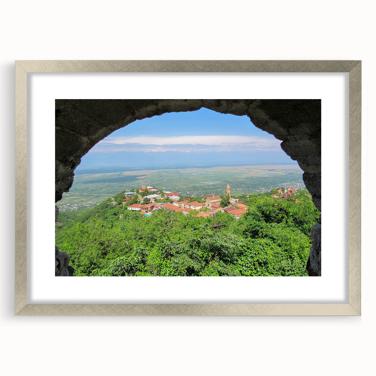 Textured art print of an abstract scenery in muted earth tones on a silver-framed mat, ideal for bedroom decor.