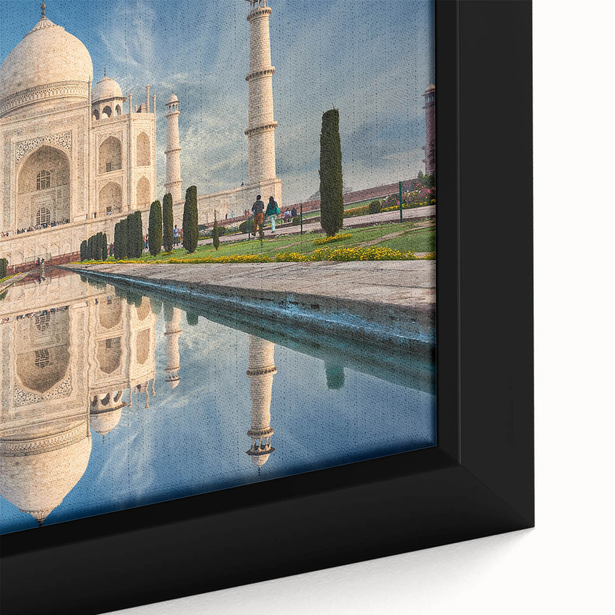 Close-up of black wall art featuring a textured, colorful Indian scenery on a framed canvas, ideal for living room decor.