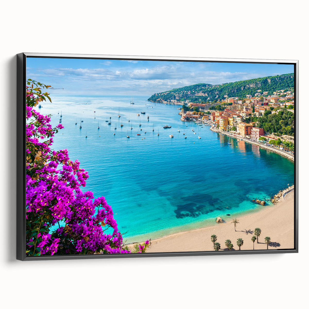 Black and white wall art featuring a vintage poster-style landscape of Southern France on a framed canvas.