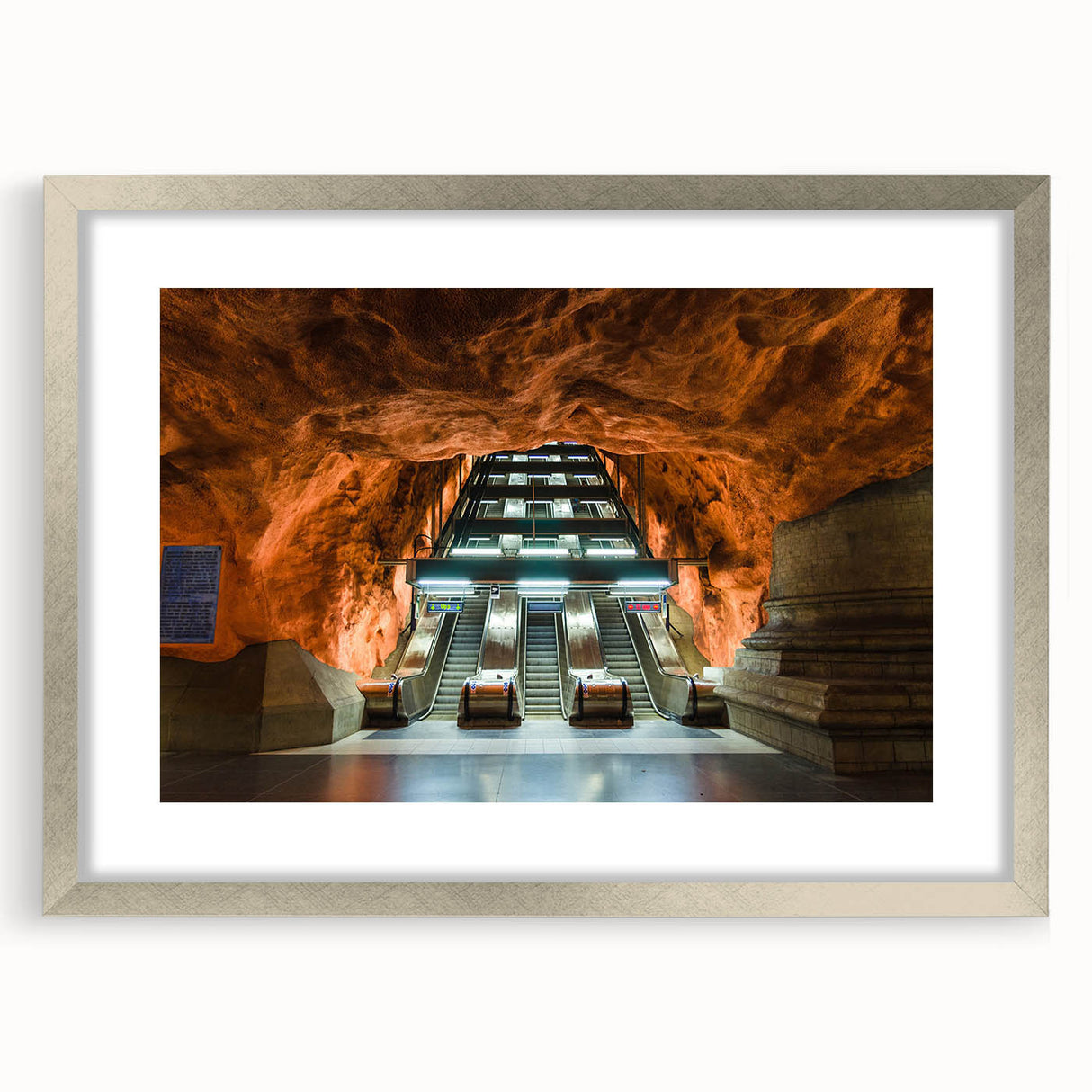 Textured abstract art print of Stockholm scenery in muted blue and gray tones, framed with a silver mat.