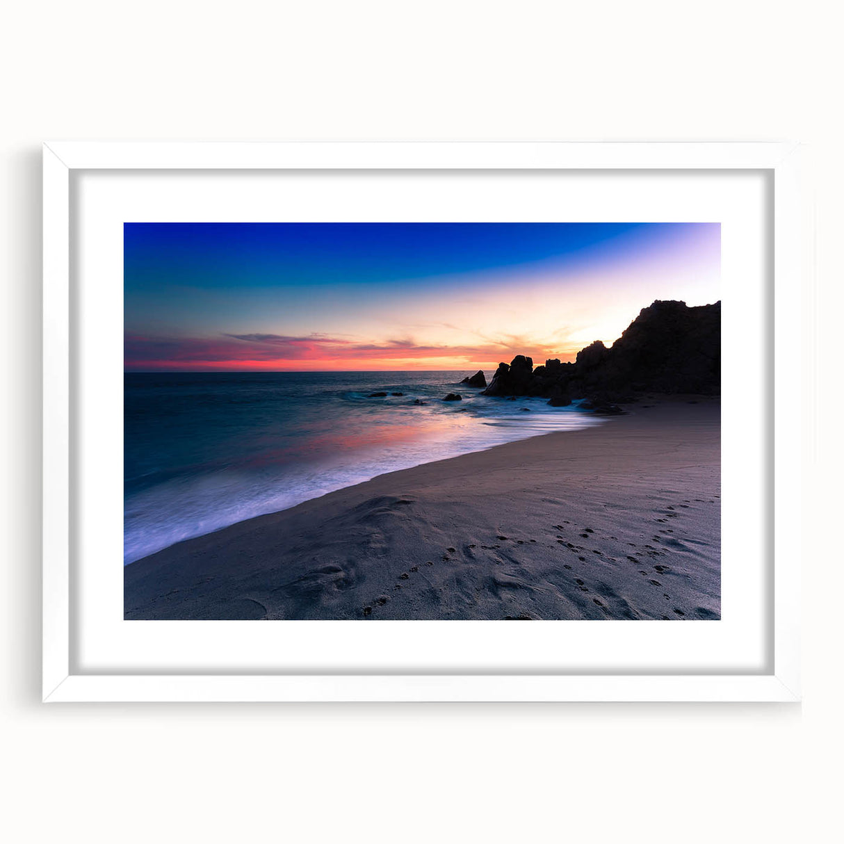 Abstract art print of Cabo San Lucas scenery in muted blue and white tones on a framed white mat.