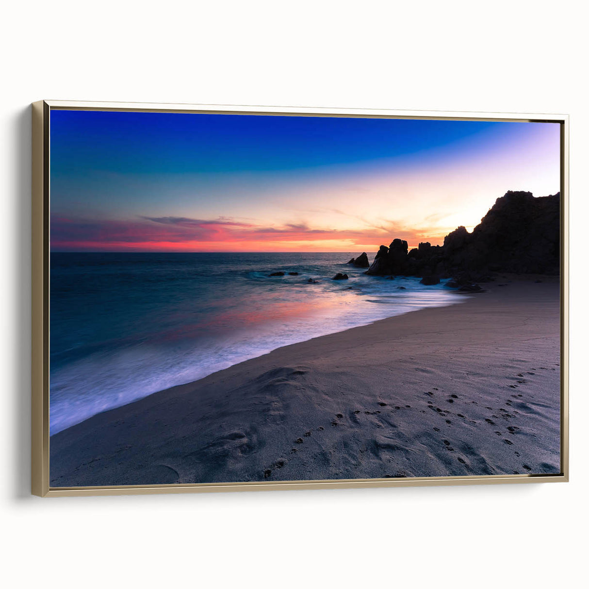 Framed canvas wall art depicting a vintage-style landscape of Cabo San Lucas with muted gold and black tones.