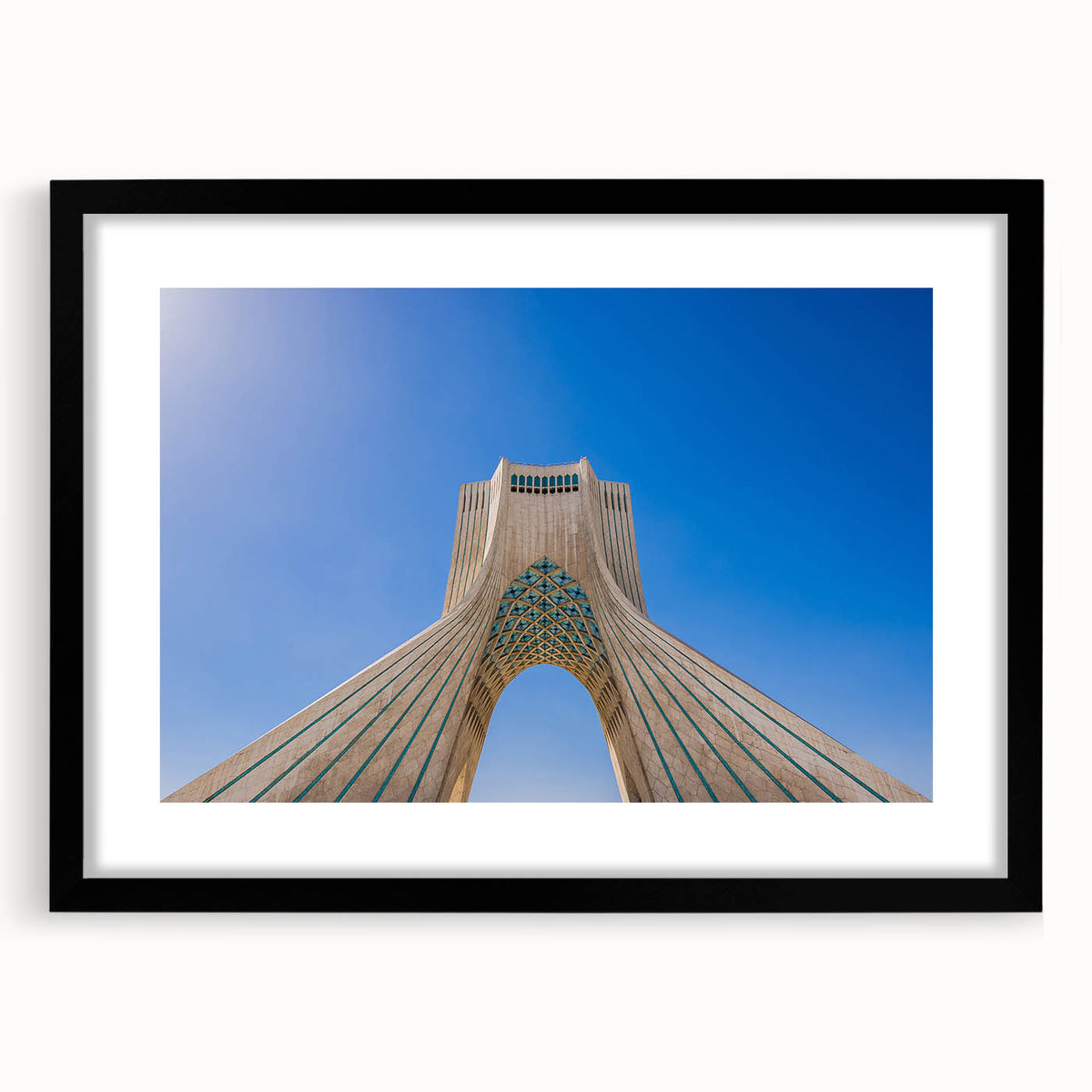 Abstract art print of a Middle Eastern scenery in vibrant colors on a textured, extra large canvas, framed in black.