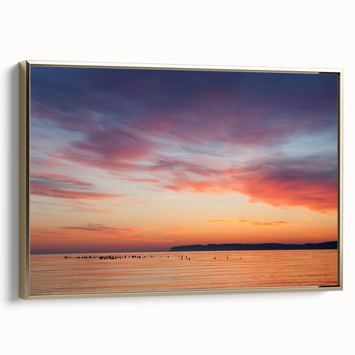 Framed canvas wall art depicting a vintage-style landscape of Lake Michigan, featuring muted blue and gold tones.