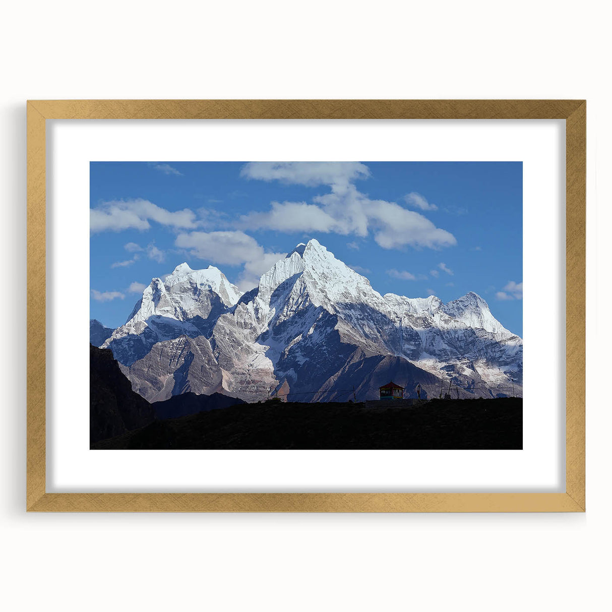 Extra large abstract art print of a textured Nepalese landscape in muted earth tones, framed in gold.