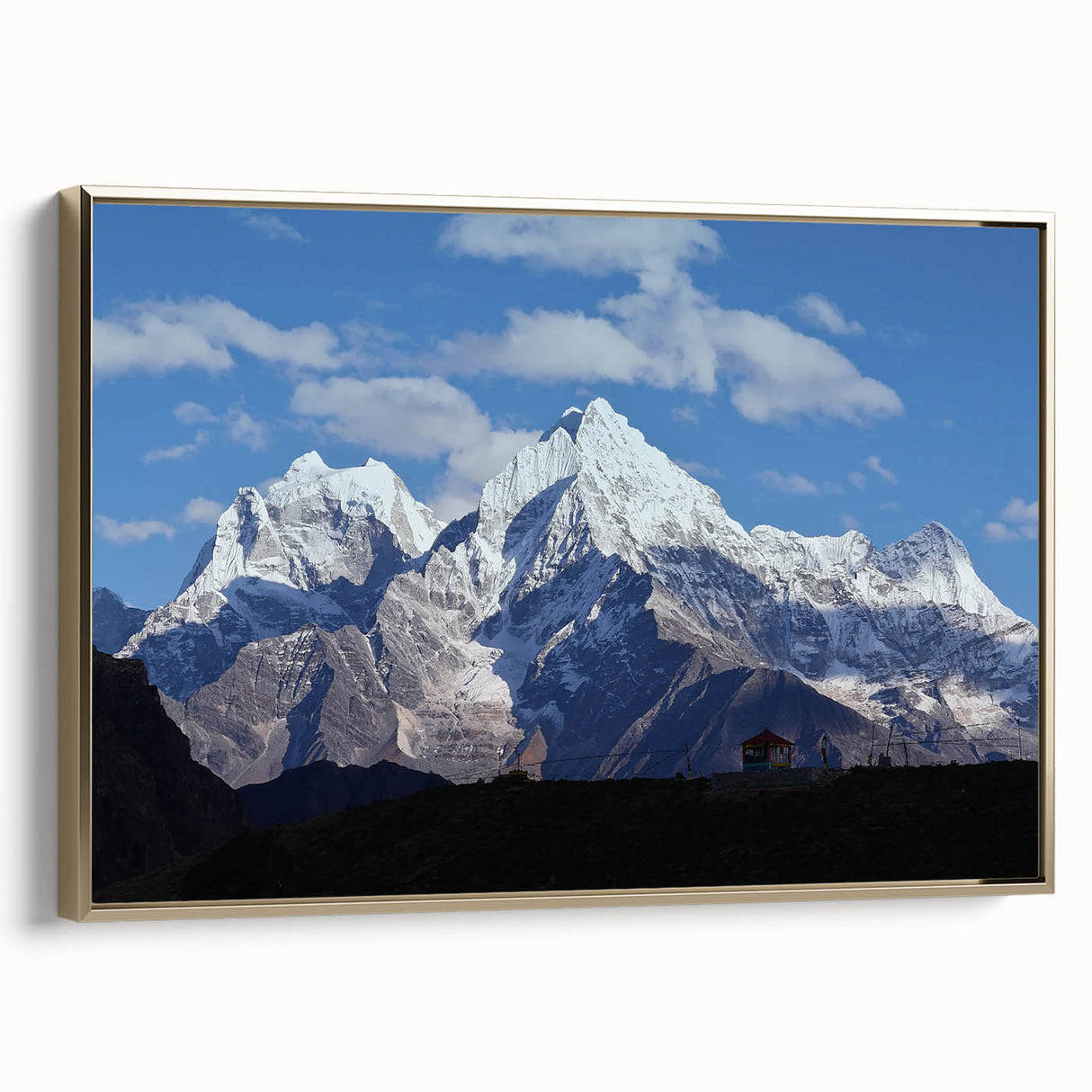 Framed canvas featuring a vintage-style landscape art painting of a scenic Nepalese view in colorful hues.
