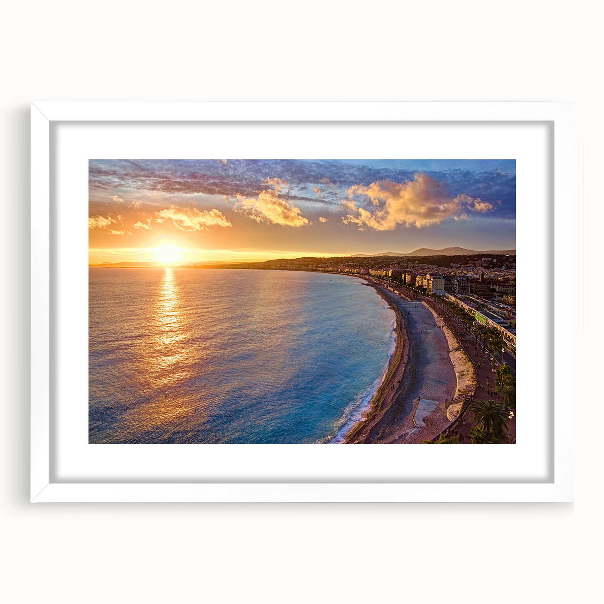 Textured abstract art print of a European seaside in muted blue and white tones, framed with a white mat.