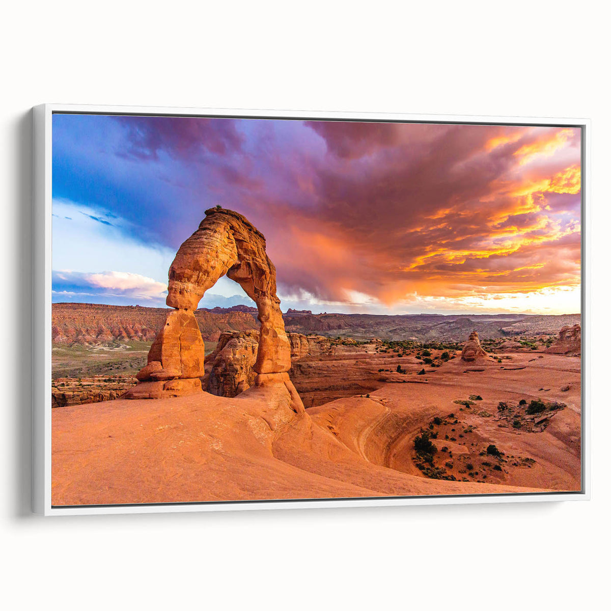 Extra large framed canvas depicting Arches National Park in Utah, featuring a textured black foreground and colorful sky.
