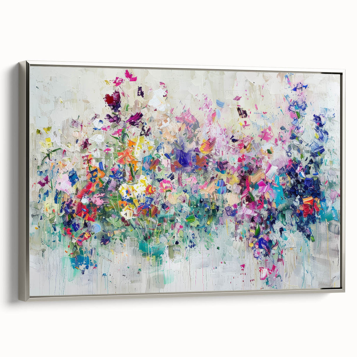 Framed canvas artwork showcasing an abstract splatter design in vibrant colors with a sleek silver frame, ideal for modern home decor and artistic interiors.