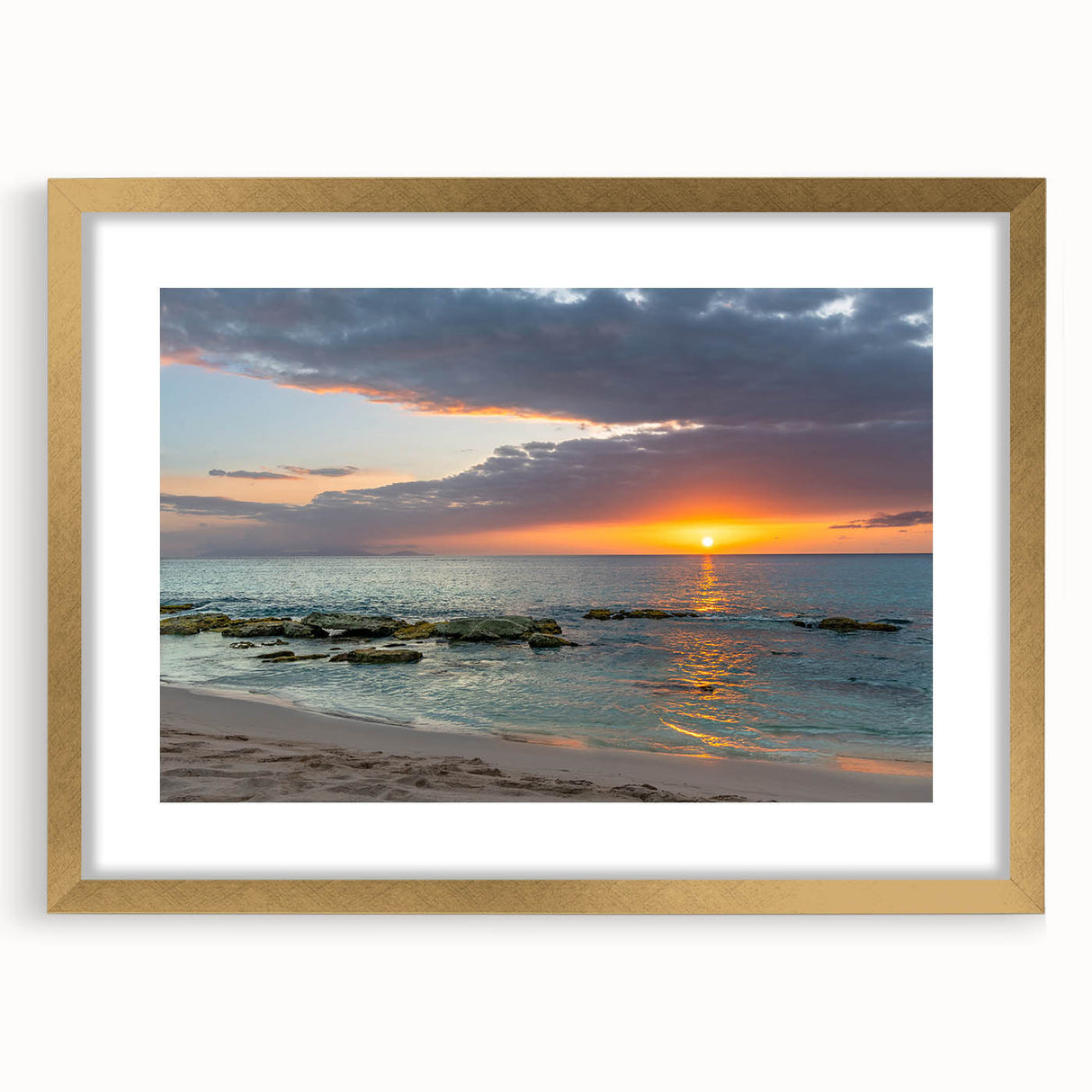 Abstract art print of Caribbean scenery in muted blue and green tones, framed in gold, ideal for dining room decor.