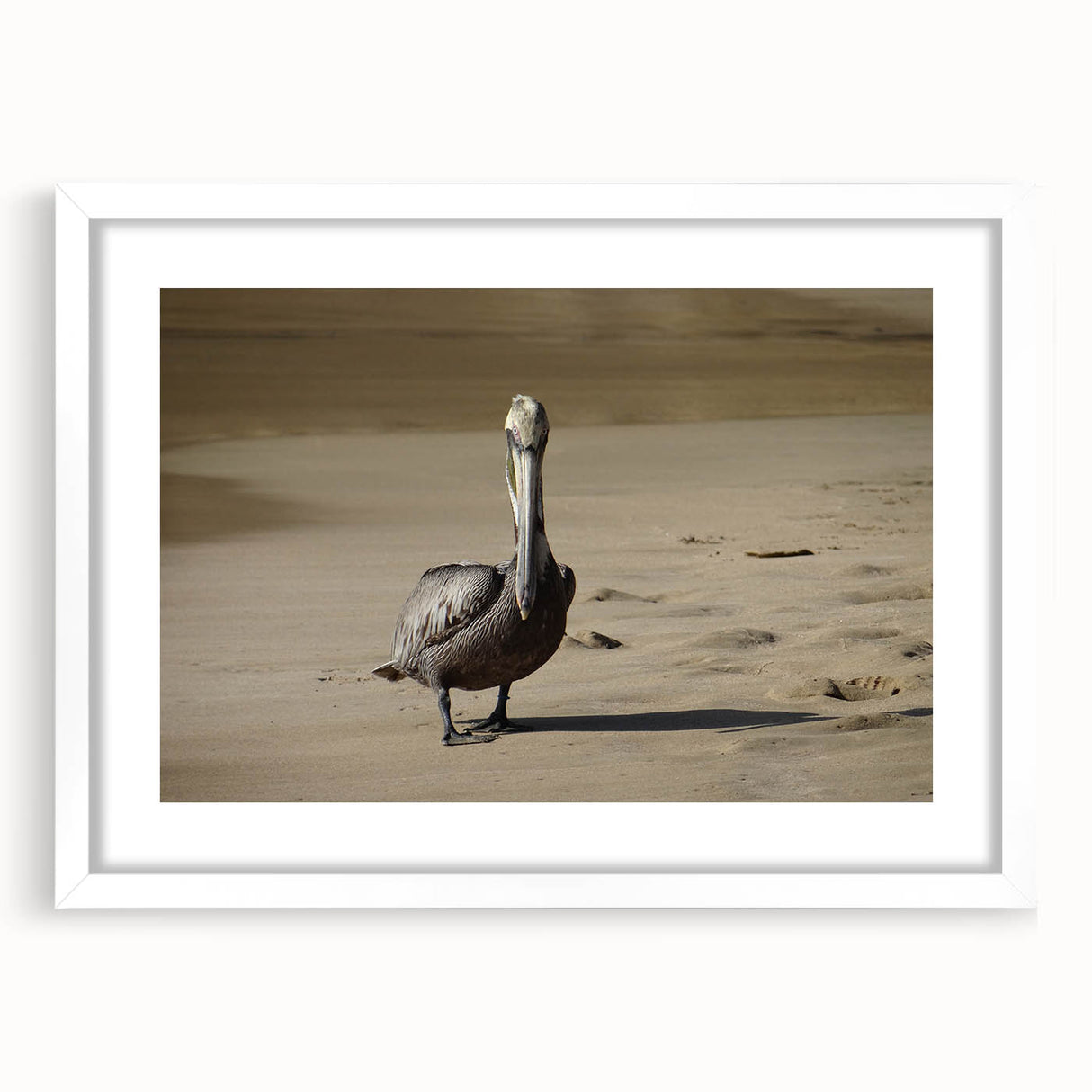 Textured abstract art print of a Caribbean scenery in muted blue and green tones, framed with a white mat.