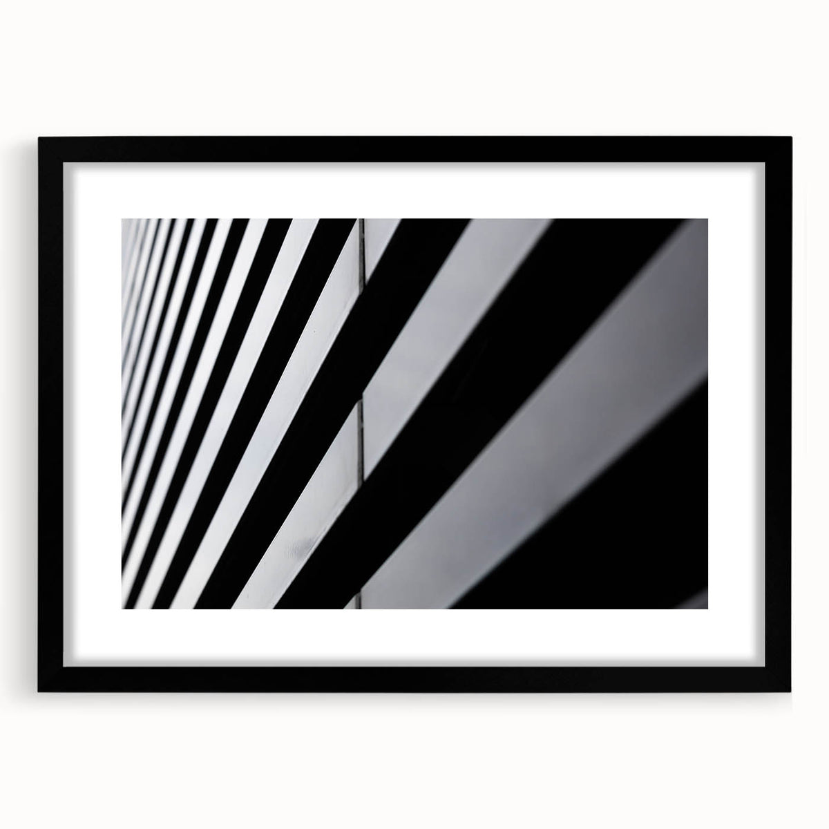 Colorful abstract art print of Amsterdam scenery in vibrant hues on a large textured canvas, framed in black.