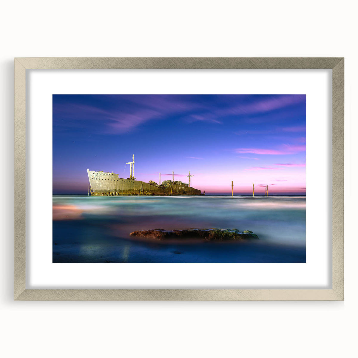 Textured abstract art print depicting a Middle Eastern scenery in muted earth tones, framed with a silver mat.