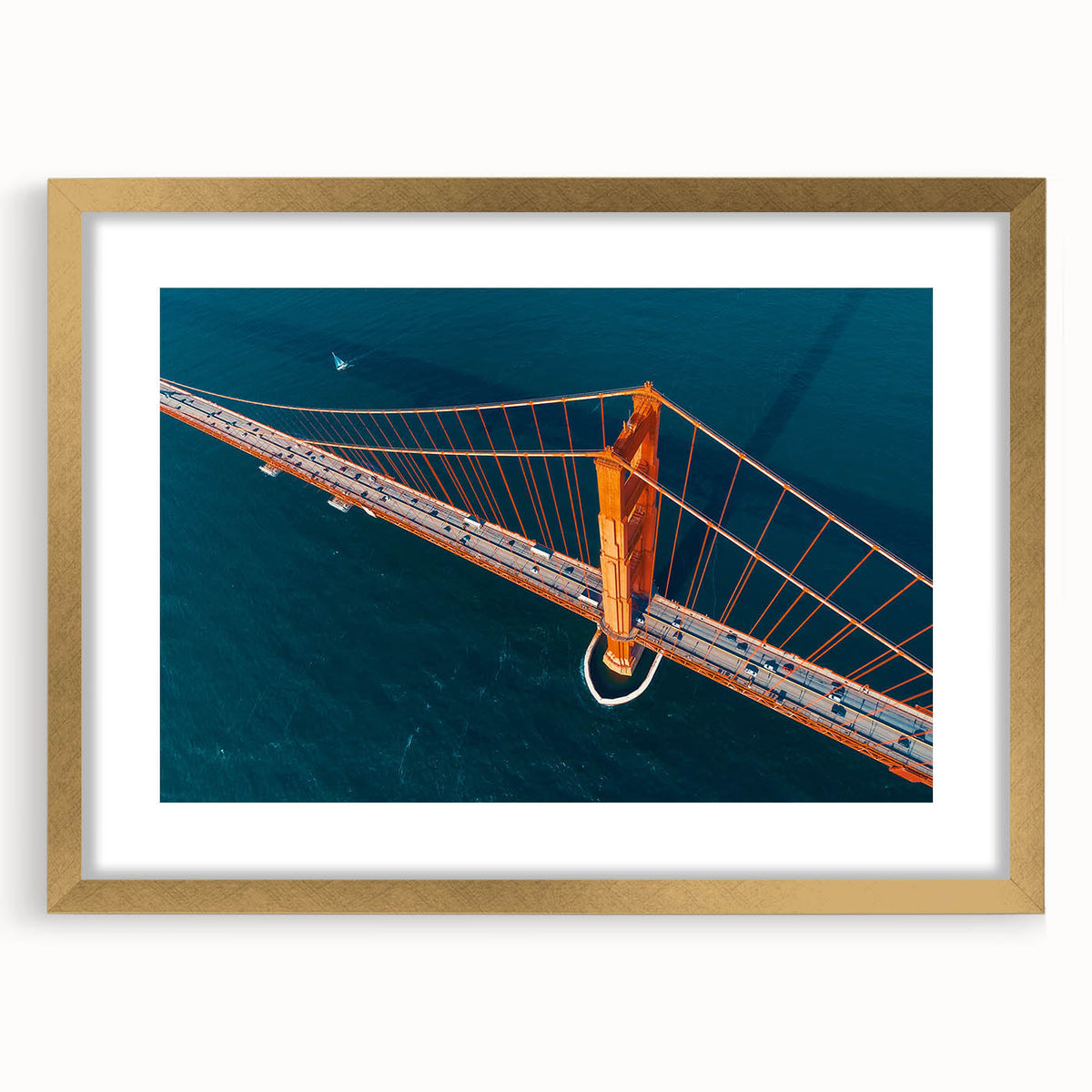 Extra large abstract art print depicting San Francisco scenery in textured blues and golds, framed in gold.