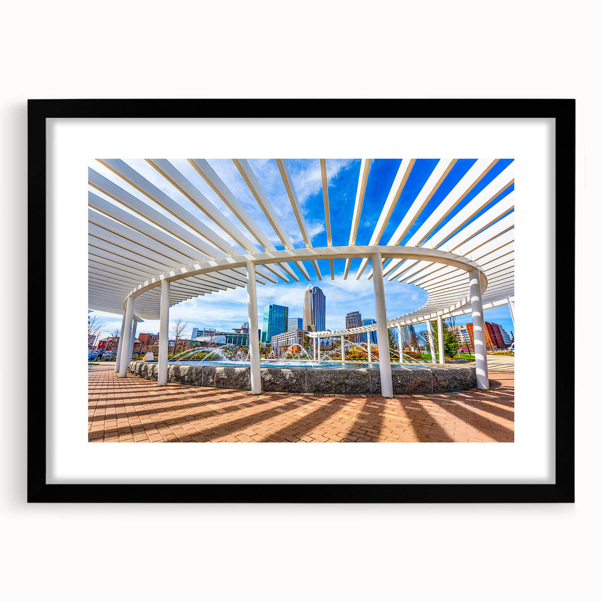 Abstract art print of Charlotte skyline in vibrant colors on a large framed canvas, ideal for living room decor.