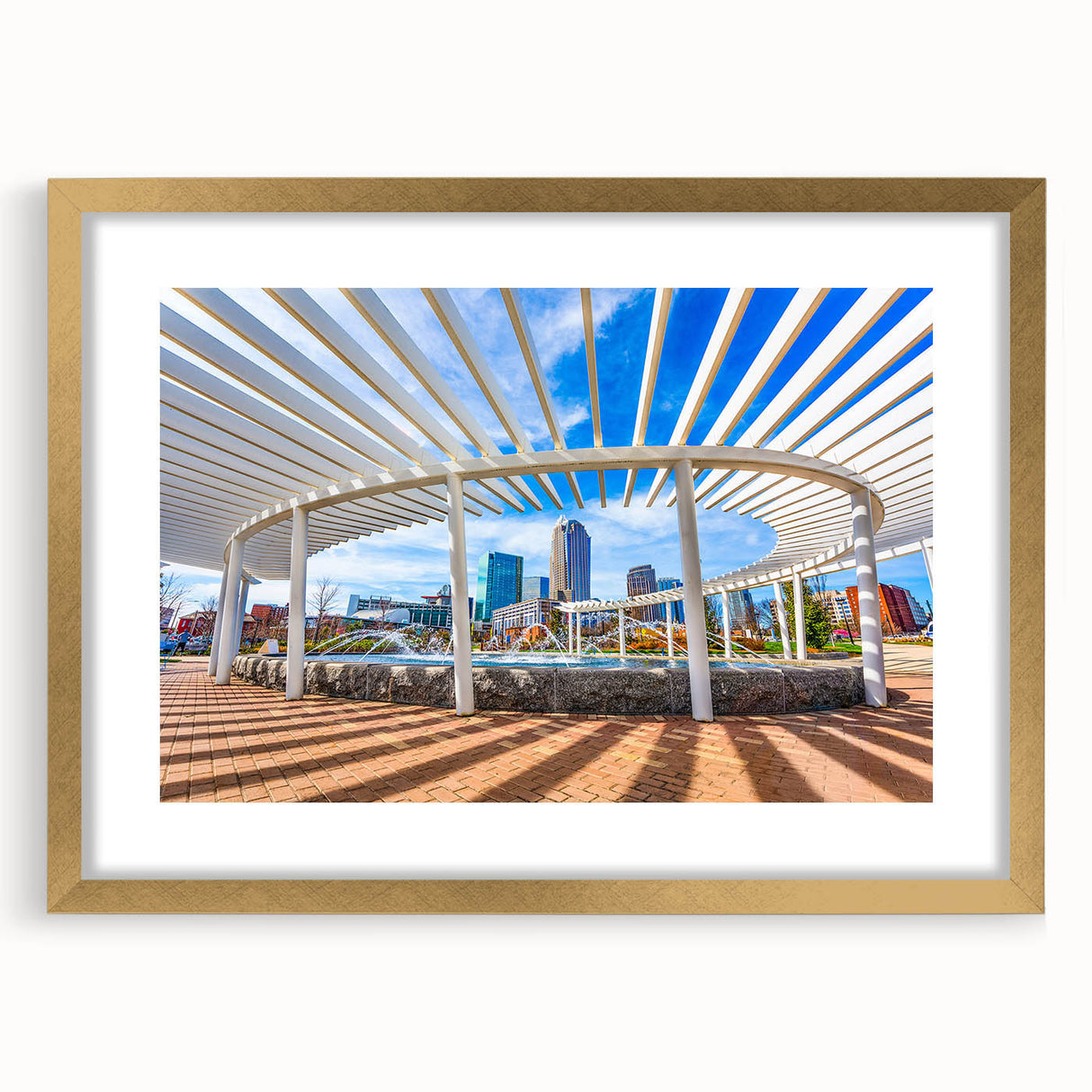 Extra large abstract art print of Charlotte skyline in muted gray, framed in gold, ideal for living room decor.